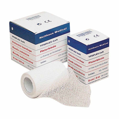 Haft-Mullbinde YPSIFLEX® haftend, elastisch: hellgraue Binde auf Rolle und Karton